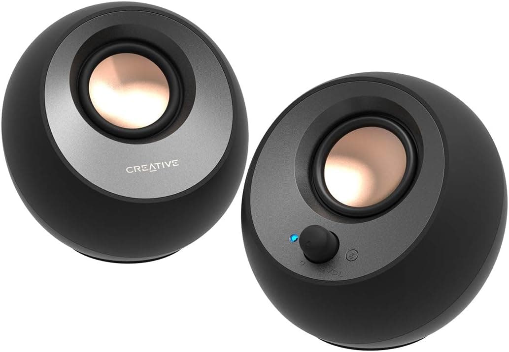 Pair of black Creative Pebble V3 desktop speakers on a white background.